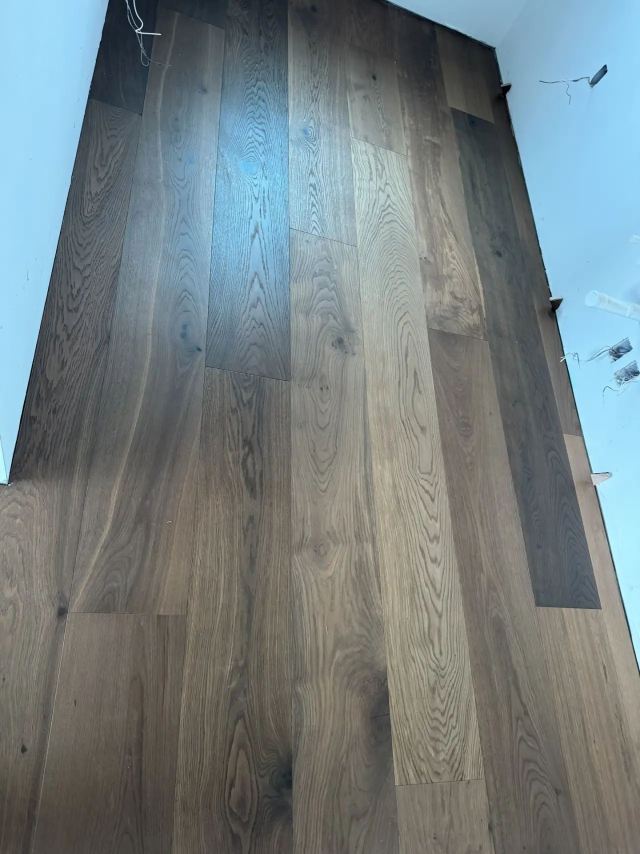 Installation · Laid and fitted board by board against the walls and stairs.