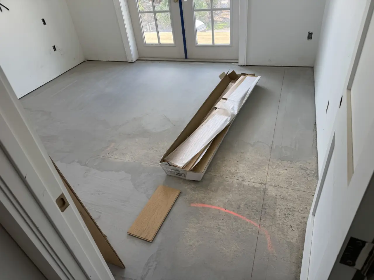 Prep · Slab checked, cleaned and marked before any plank goes down.