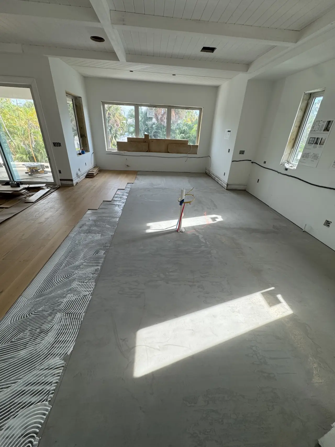 Installation · Adhesive troweled section by section, boards set to the layout lines.