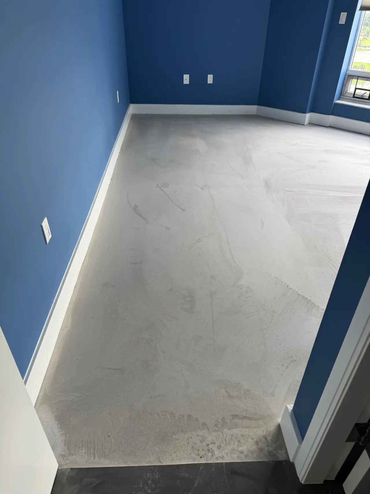 Before: Corner room · leveled concrete to finished floor