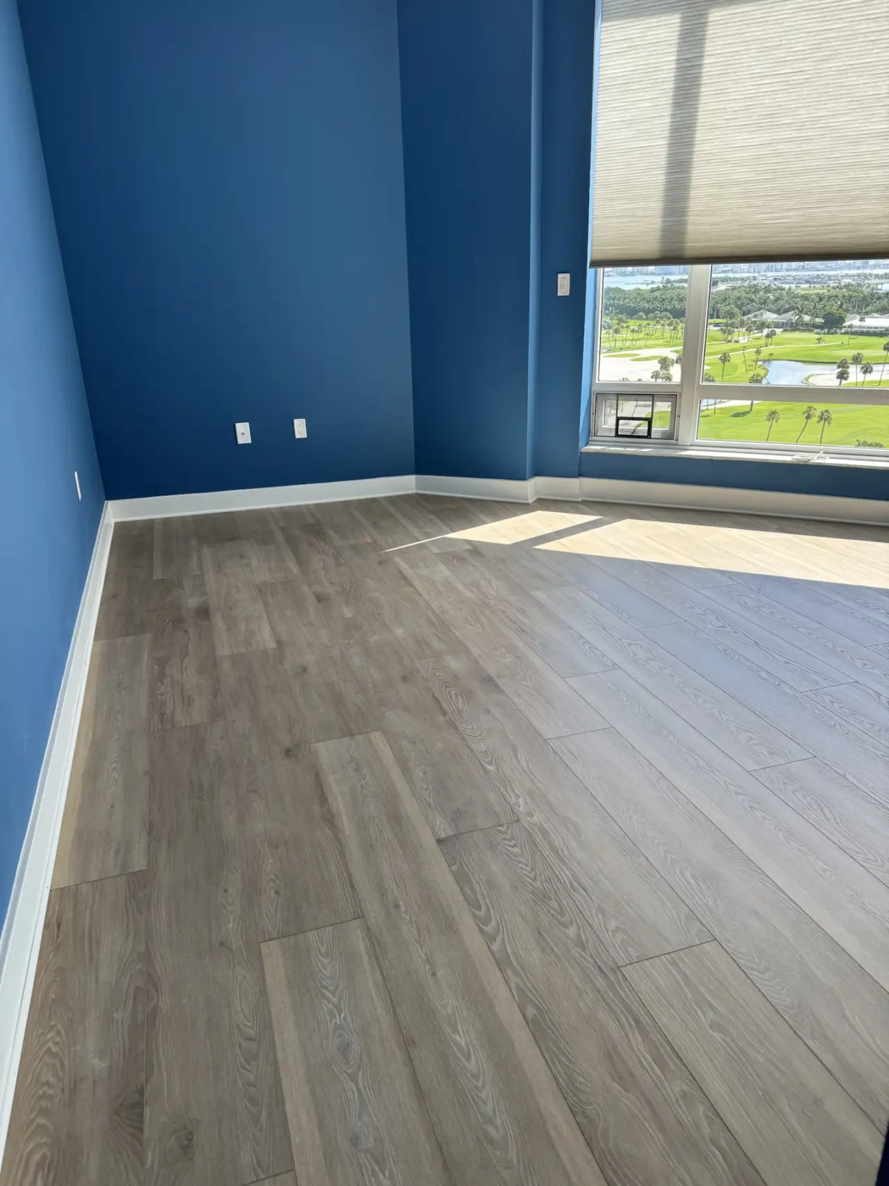 After: Corner room · leveled concrete to finished floor