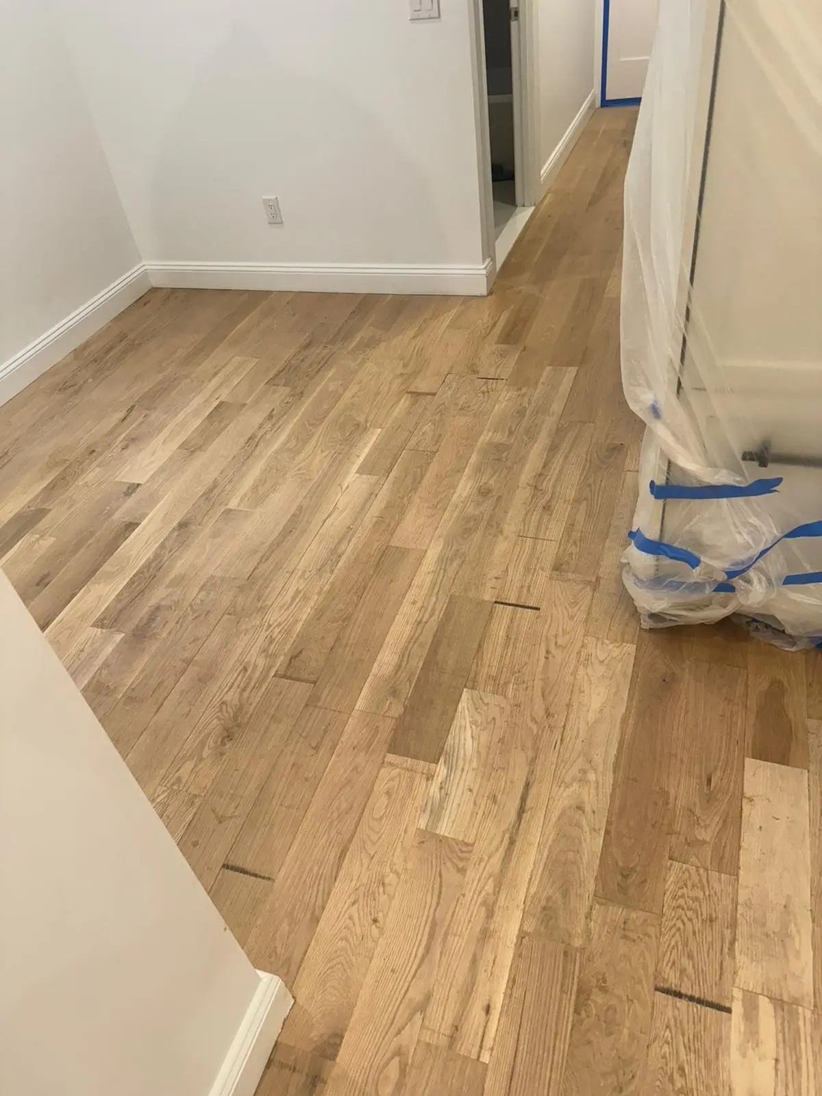 Installation · New hardwood glued and nailed into the repaired areas.