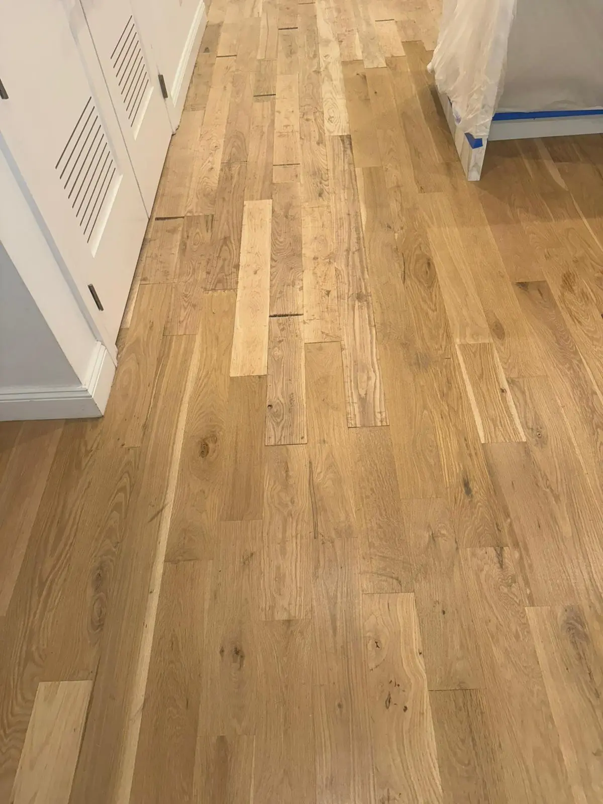 Installation · New hardwood glued and nailed into the repaired areas.