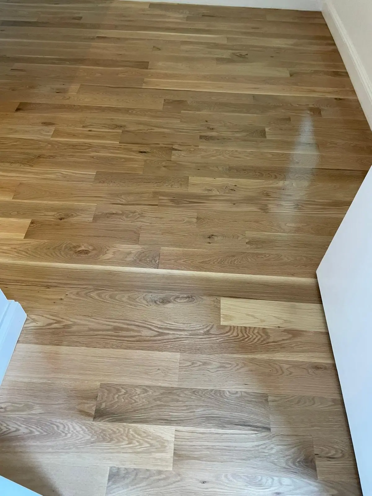 Finish · The whole floor sanded and stained as one.
