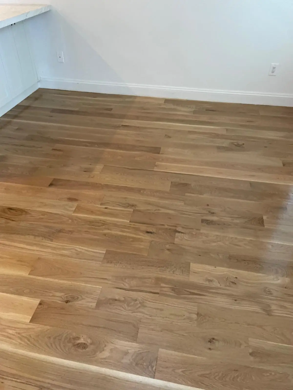 Siesta Beach Repair · Hardwood, sanded and stained to match
