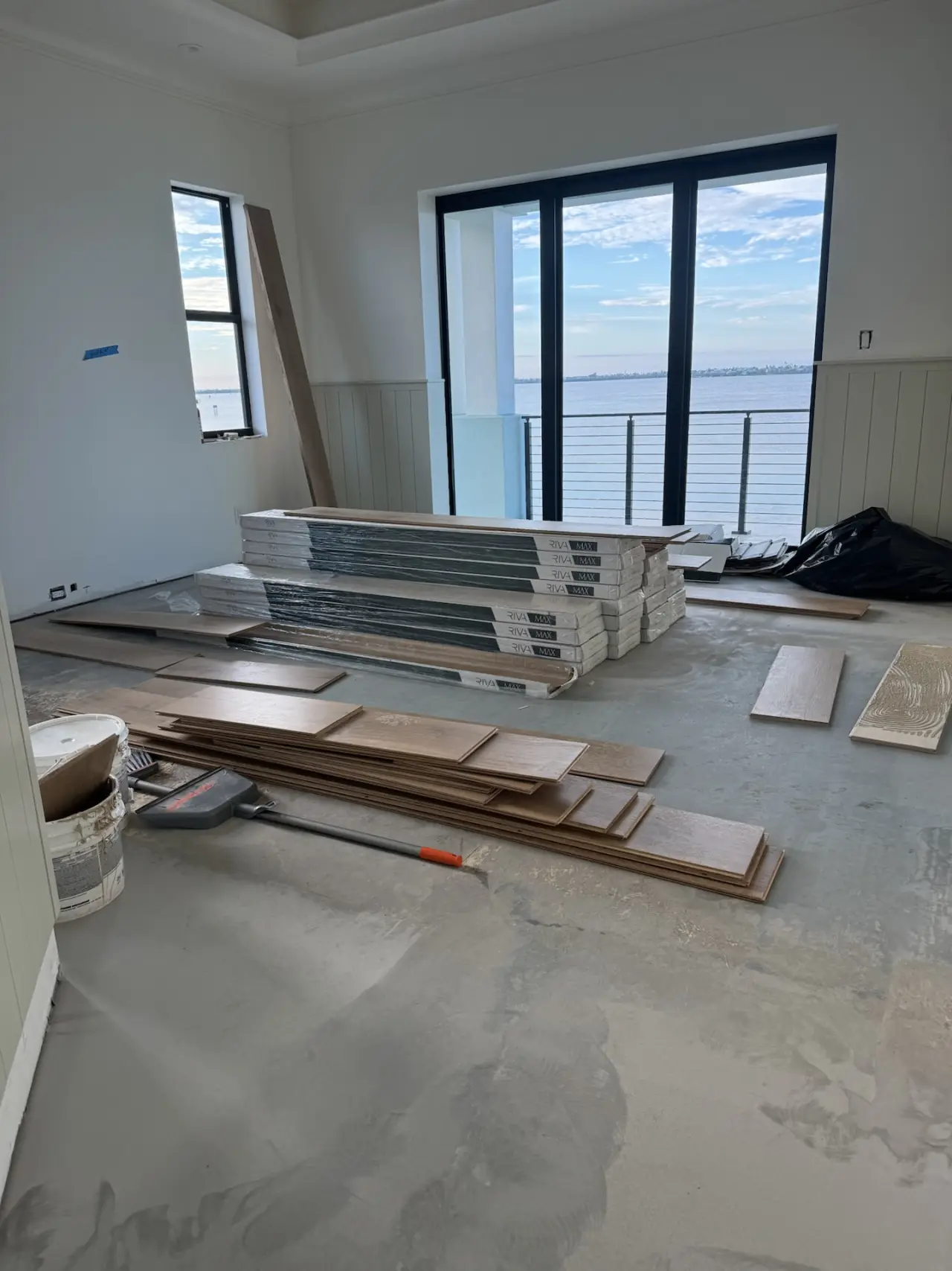 Installation · Riva boards laid out and glued down, room by room.