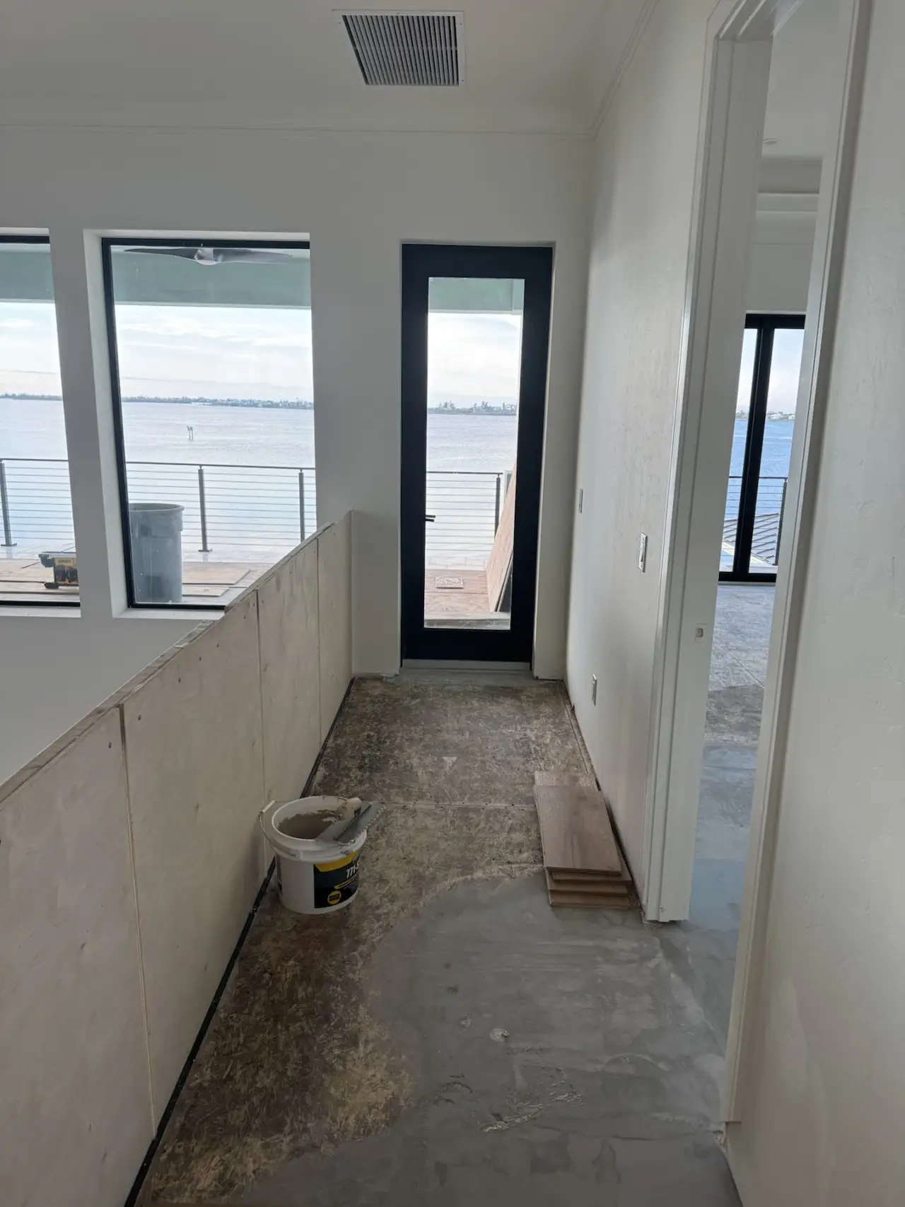 Prep · Plywood sanded and self-leveling compound applied where the floor needed it.
