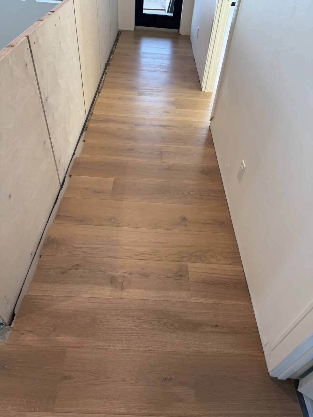 After: Hallway · prepared subfloor to finished floor