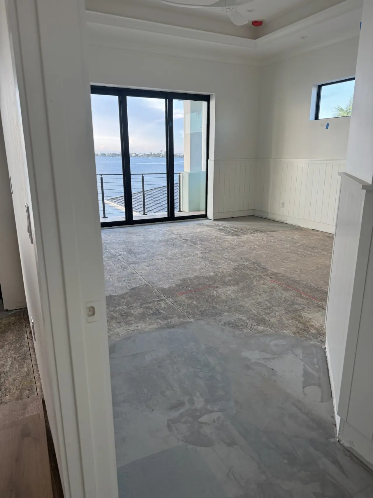 Installation · Riva boards laid out and glued down, room by room.